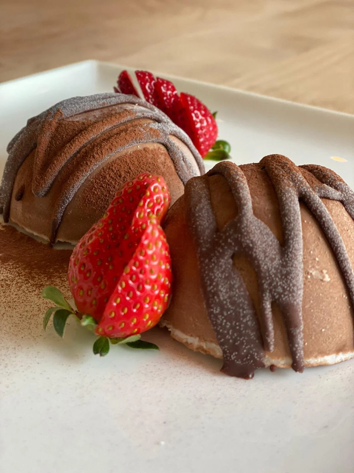 Chocolate gelato domes with fresh strawberries